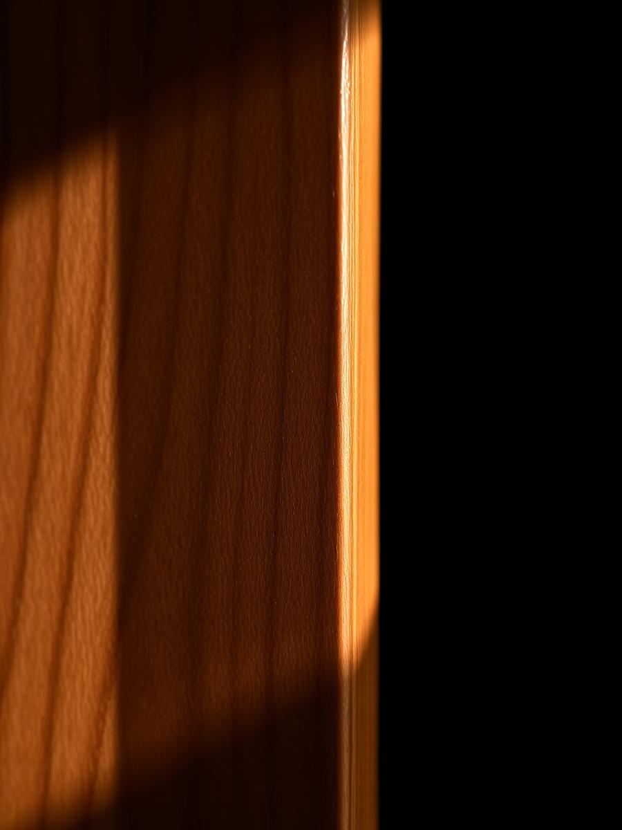 Close detail of walnut grain on a cabinet edge